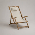 Chaise longue de jardin pliante en bois d'acacia avec toile polyester écrue et coussin appui-tête 60x90x100 cm